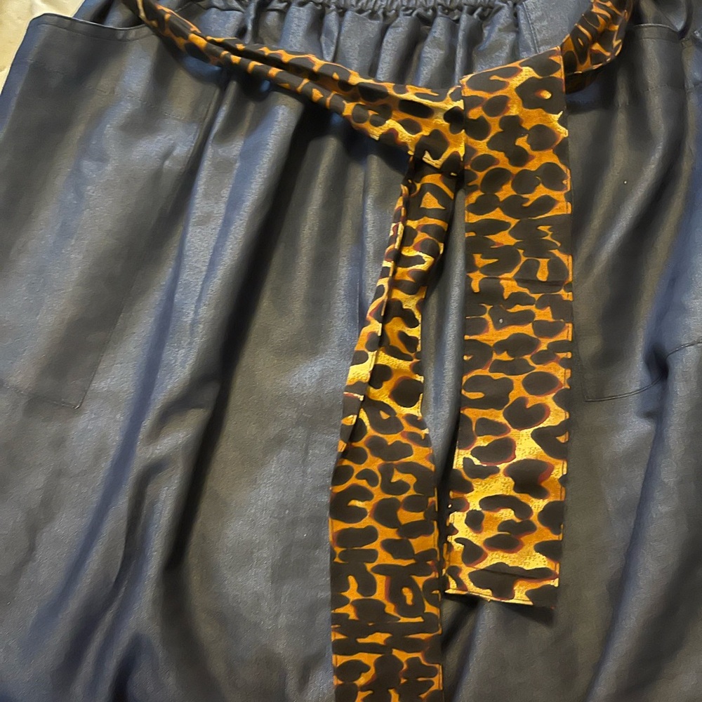Very chic blue Jean skirt with Cheetah belt and side inserts